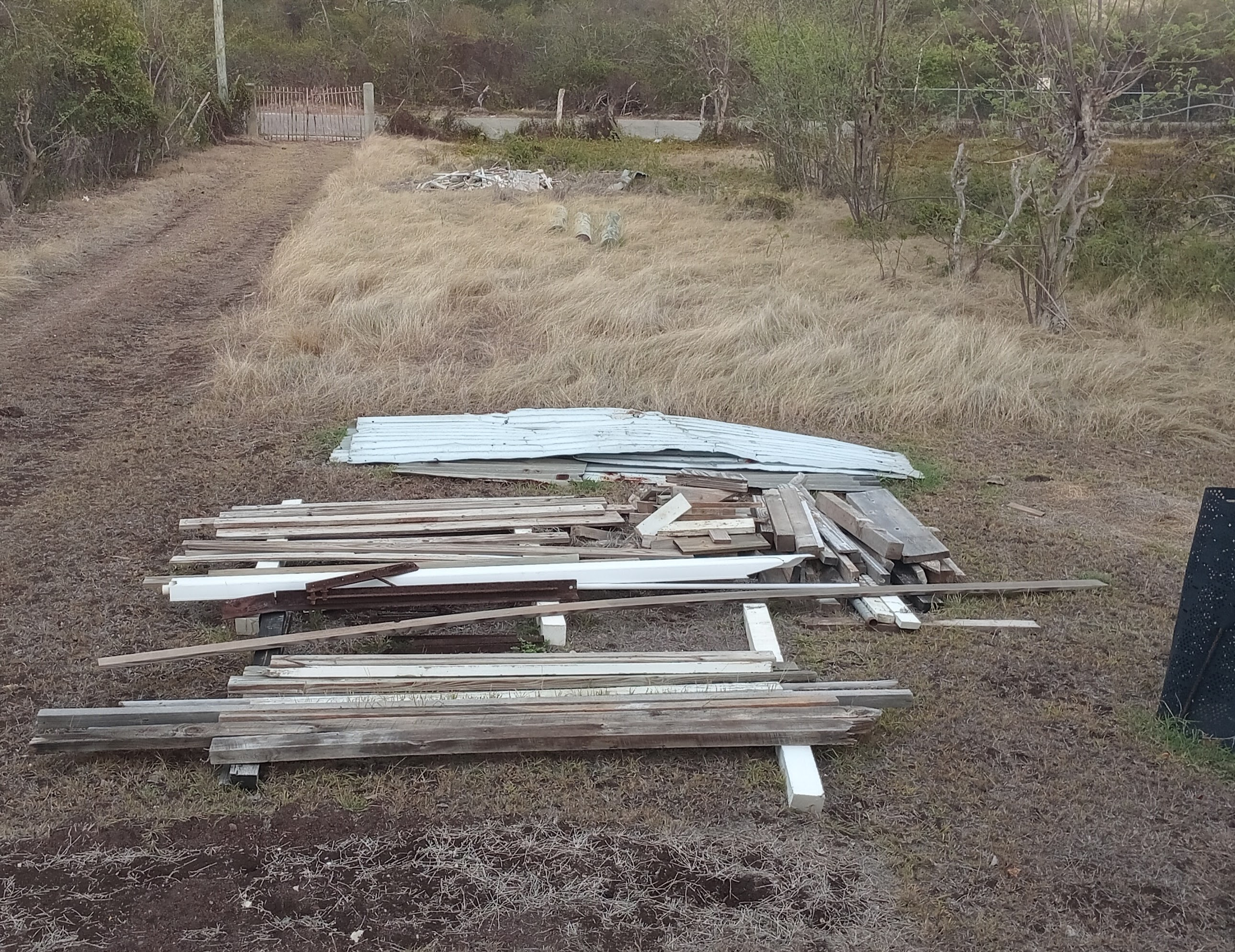 Old roofing to be removed and lumber to be relocated