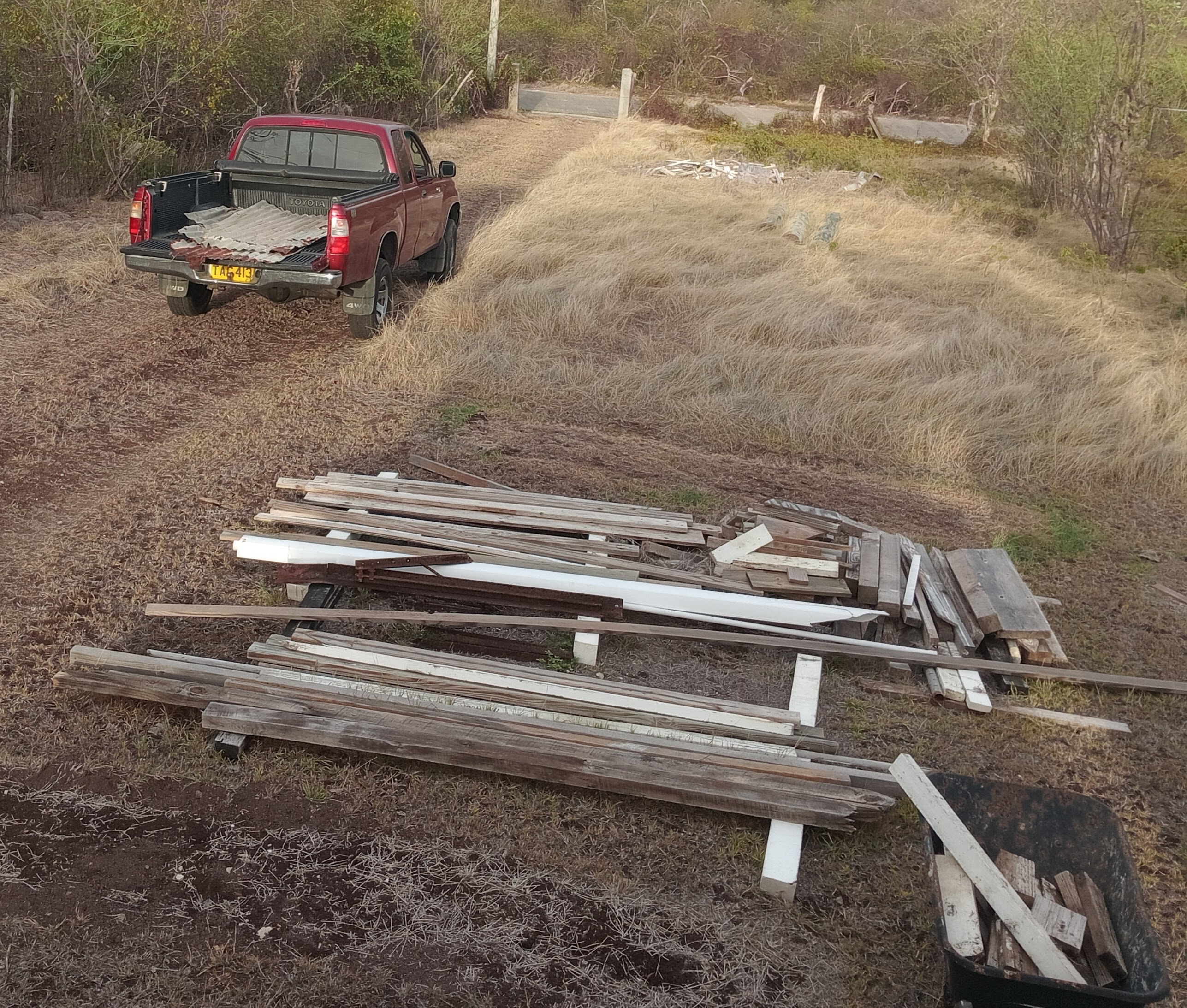 Max's truck with the old roofing for the bin